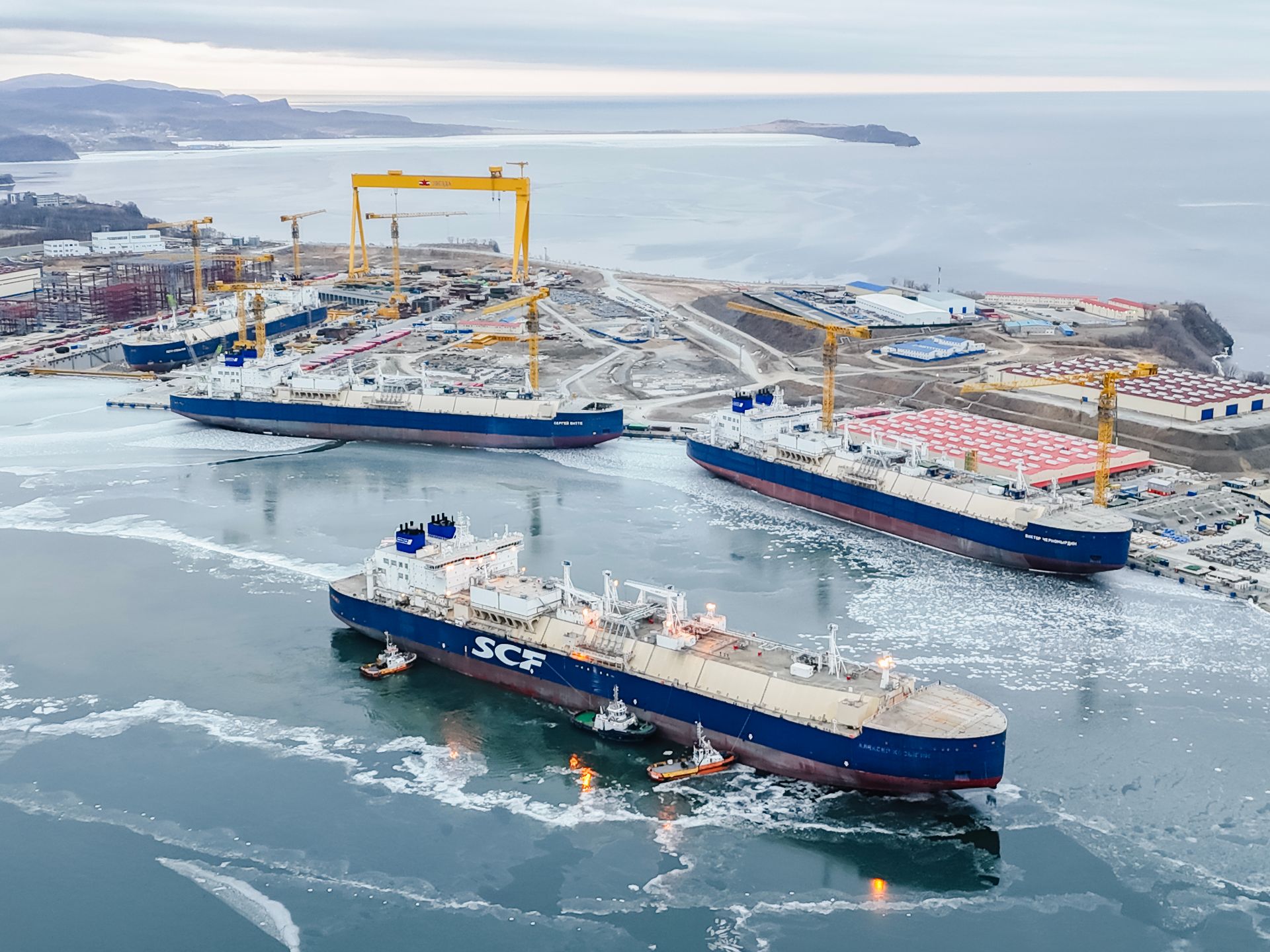 Zvezda Shipbuilding Complex in Bolshoy Kamen, with ships, docks and gantry cranes